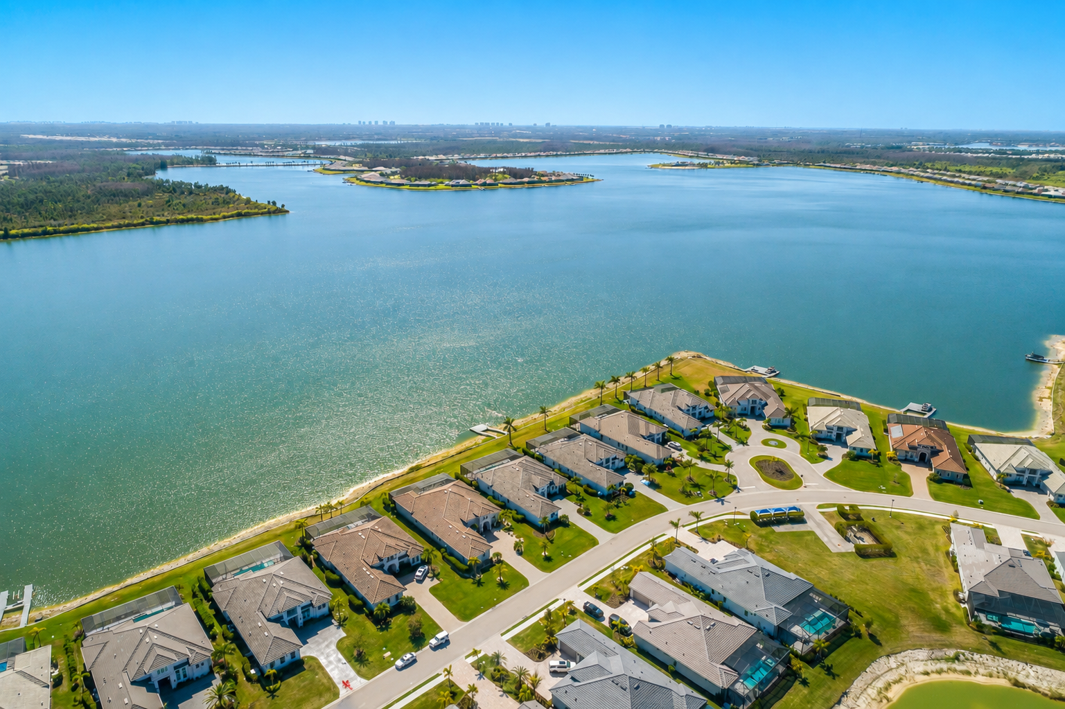 Aerial view of lakefront homes in WildBlue in Fort Myers, Florida